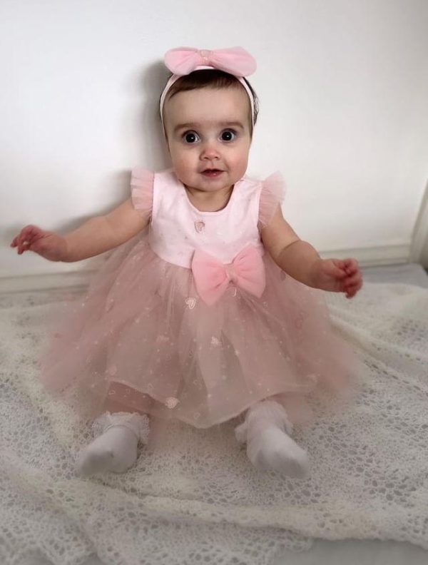 Baby girl with pink hot sale dress